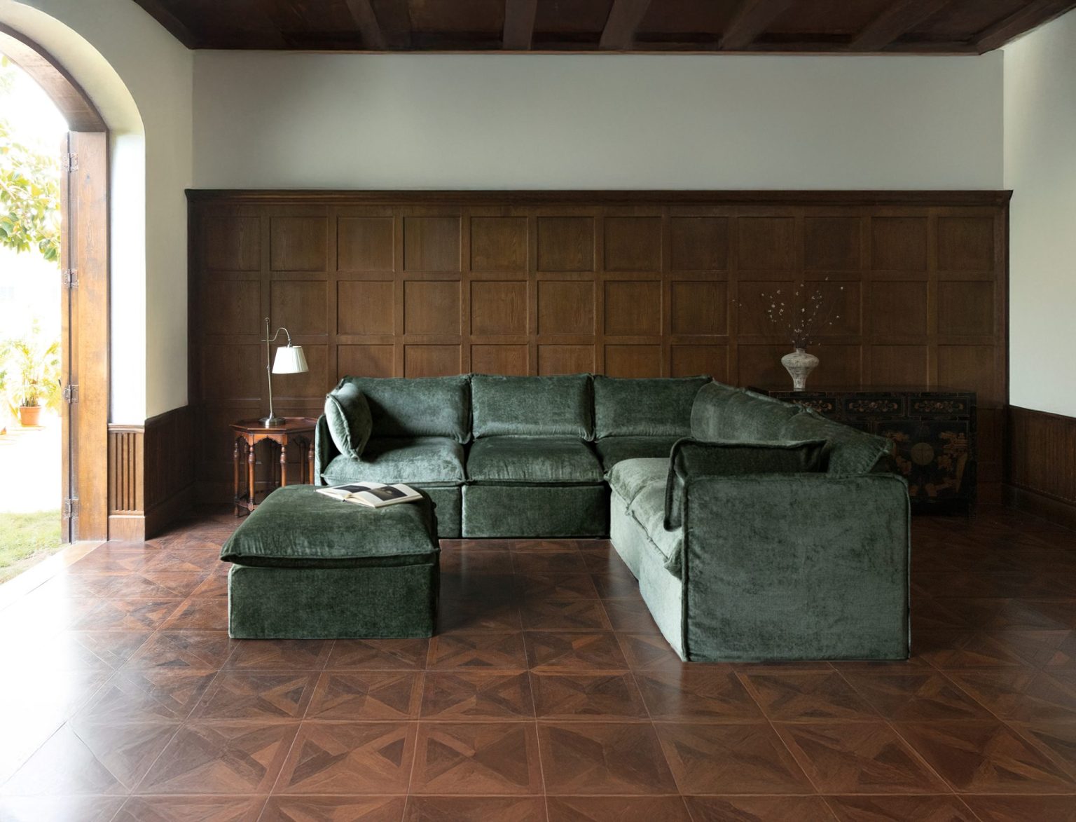 Anabei L-shaped modular sectional with ottoman in Willow green washable fabric in a wood-paneled room